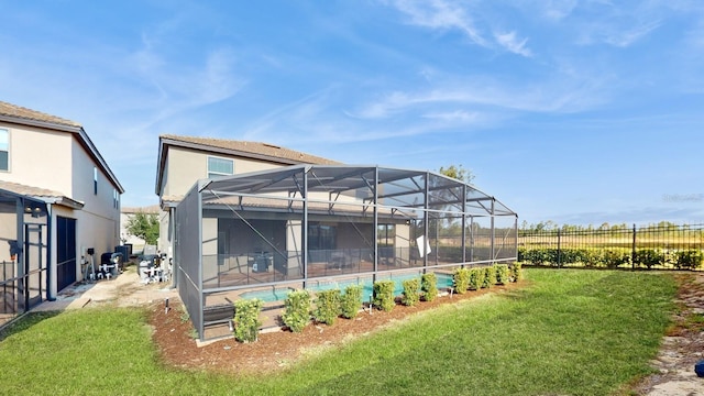 view of yard featuring glass enclosure