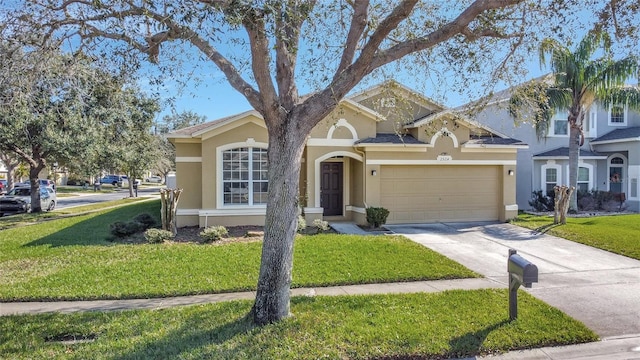 ranch-style house featuring a front yard and a garage