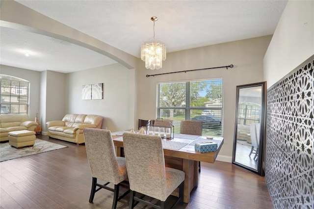 dining room featuring a chandelier and dark hardwood / wood-style flooring