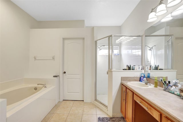 bathroom featuring tile patterned flooring, vanity, and plus walk in shower