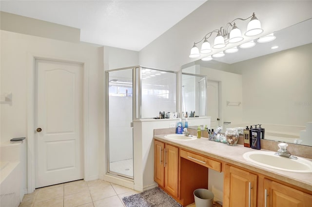 bathroom featuring tile patterned flooring, vanity, and walk in shower