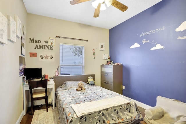 bedroom with ceiling fan and wood-type flooring