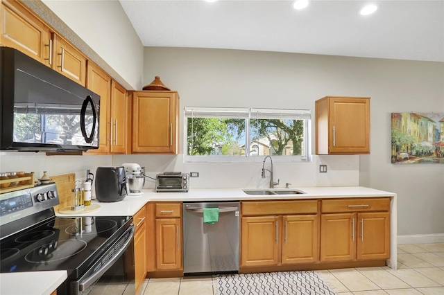 kitchen featuring sink, light tile patterned floors, and appliances with stainless steel finishes