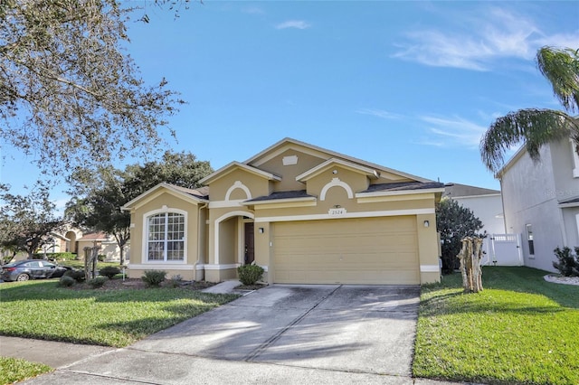 view of front facade with a garage and a front lawn