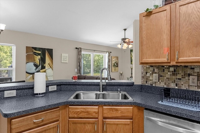 kitchen featuring sink, ceiling fan, dishwasher, and tasteful backsplash