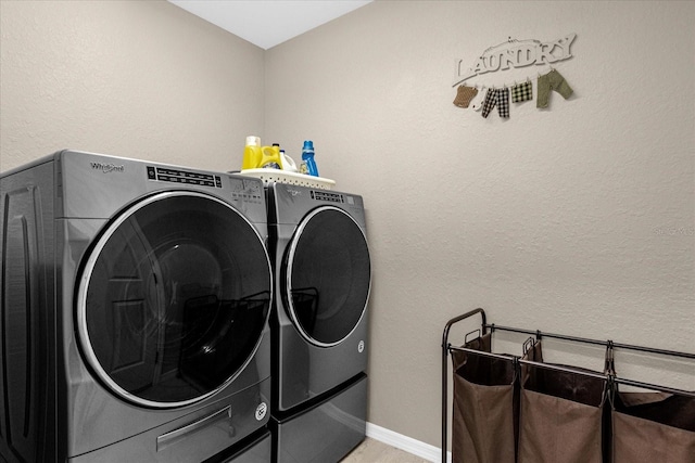 washroom featuring washer and dryer