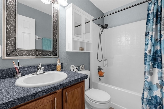 full bathroom with shower / tub combo, vanity, and toilet