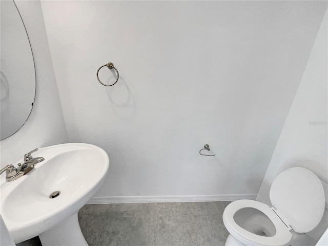 bathroom featuring sink and toilet