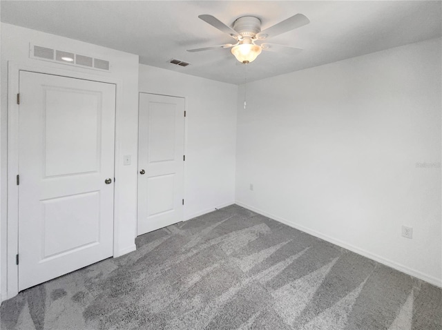 unfurnished bedroom featuring ceiling fan, carpet floors, and a closet