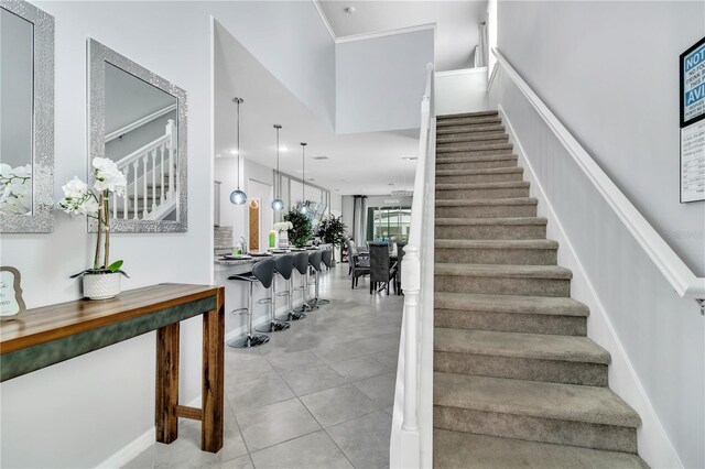 stairs with light tile floors