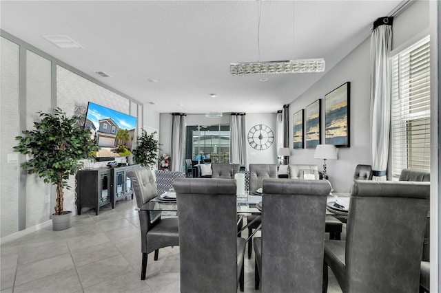 dining area with light tile patterned floors