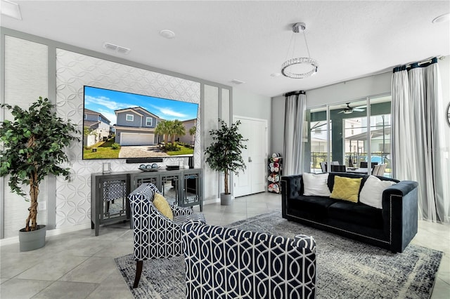 living room featuring tile floors and ceiling fan