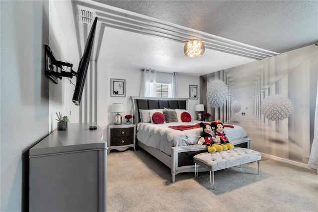 carpeted bedroom with a textured ceiling