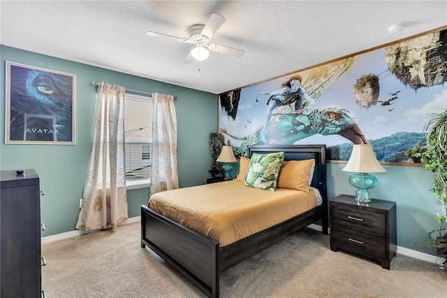 carpeted bedroom with a textured ceiling and ceiling fan