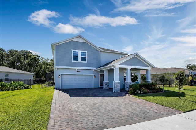 view of front of house featuring a porch, a garage, and a front lawn