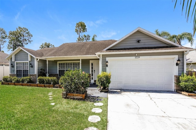 ranch-style home with a front yard and a garage