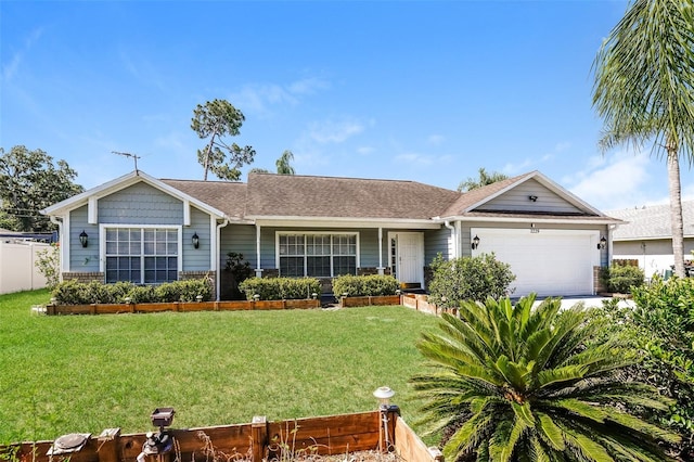 ranch-style house featuring a front yard and a garage