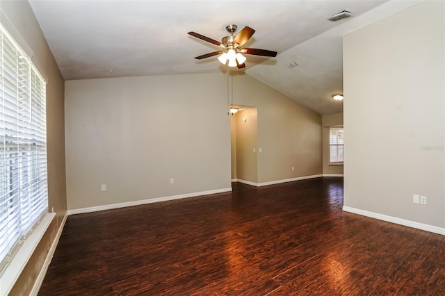 spare room with dark hardwood / wood-style flooring, ceiling fan, and lofted ceiling