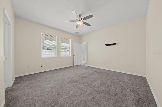 unfurnished room featuring ceiling fan and carpet floors