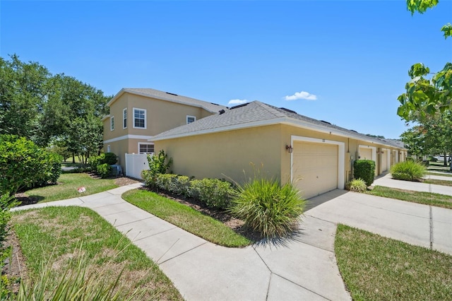 view of property exterior featuring a garage