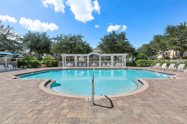 view of pool featuring a patio area and a pergola