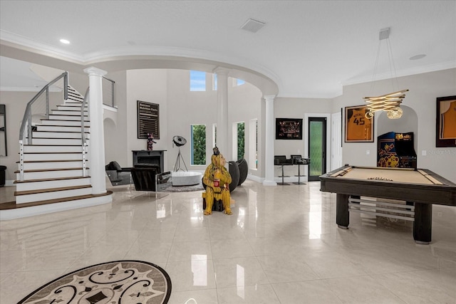 playroom featuring billiards, ornamental molding, and decorative columns