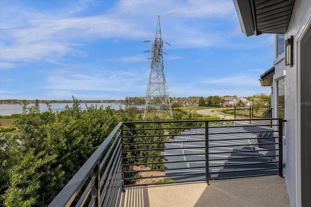 balcony featuring a water view