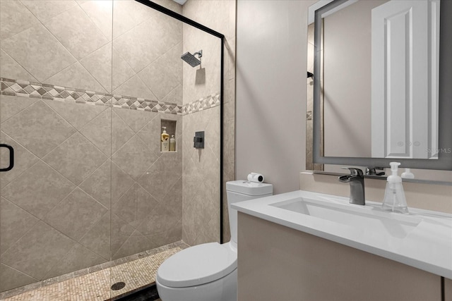 bathroom with vanity, toilet, and walk in shower