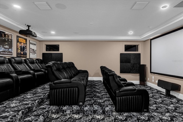 home theater featuring crown molding, a raised ceiling, and carpet flooring