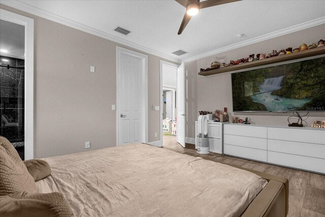 bedroom with ornamental molding, hardwood / wood-style floors, and ceiling fan