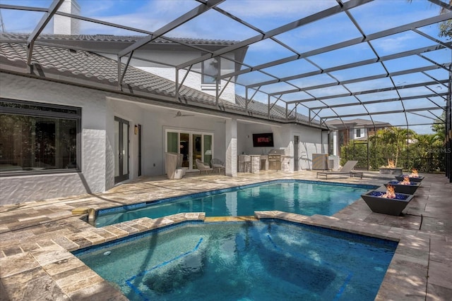 view of swimming pool featuring an in ground hot tub, area for grilling, a lanai, and a patio area