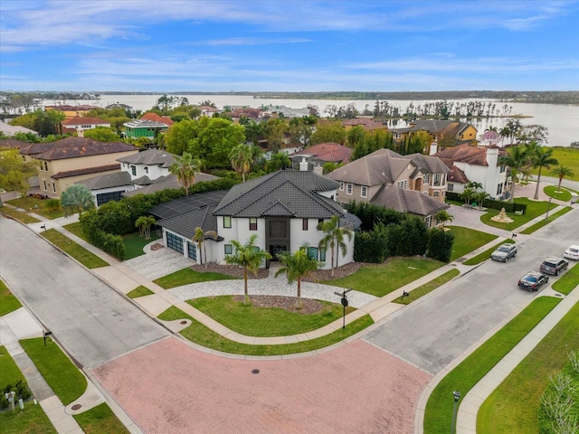 birds eye view of property with a water view