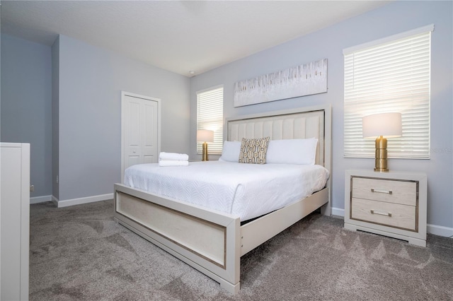 carpeted bedroom with a closet