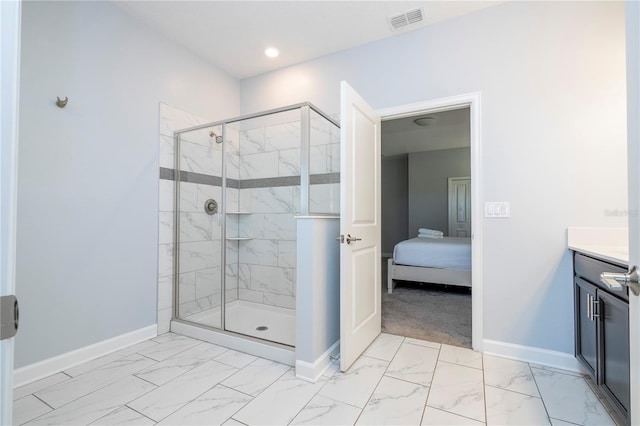 bathroom with walk in shower and vanity