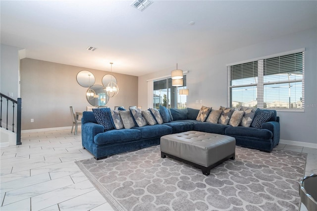 living room with an inviting chandelier