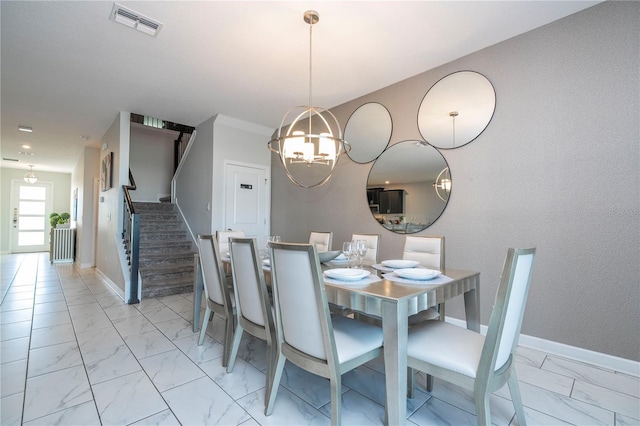 dining room featuring a notable chandelier