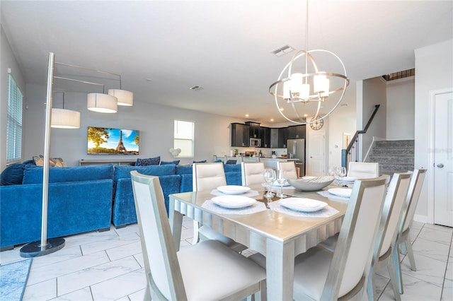 dining room featuring a chandelier