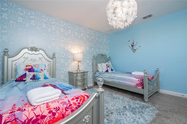 bedroom featuring carpet floors and a notable chandelier