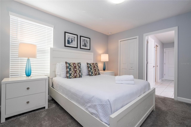 carpeted bedroom with a closet