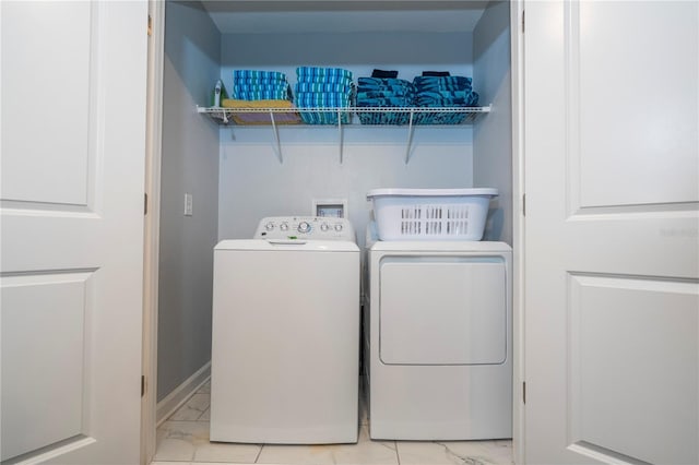 washroom featuring washing machine and dryer