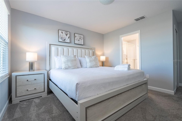 bedroom with dark colored carpet