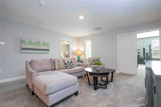 carpeted living room featuring a healthy amount of sunlight