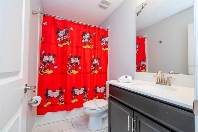 full bathroom featuring vanity, shower / tub combo, and toilet