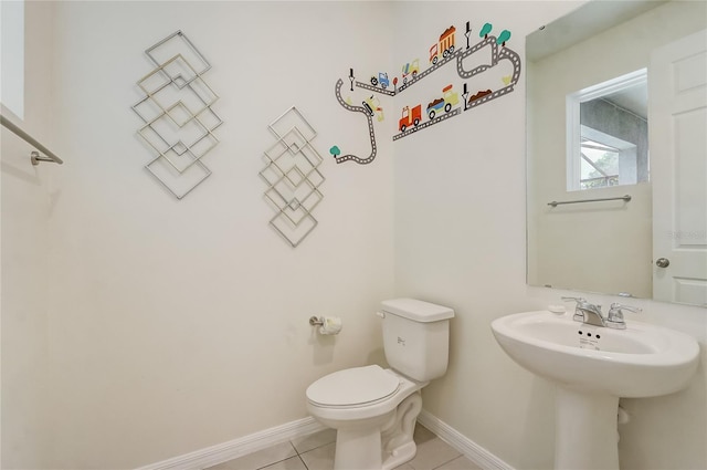 bathroom featuring tile patterned floors and toilet