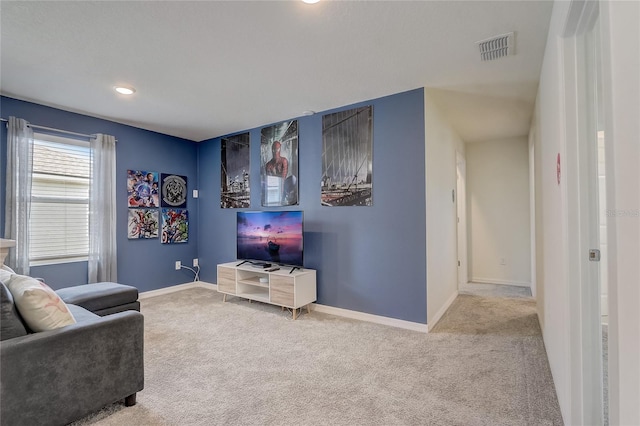 living room with carpet flooring, baseboards, and visible vents