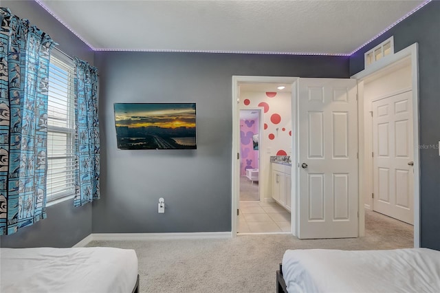 bedroom with light carpet and baseboards