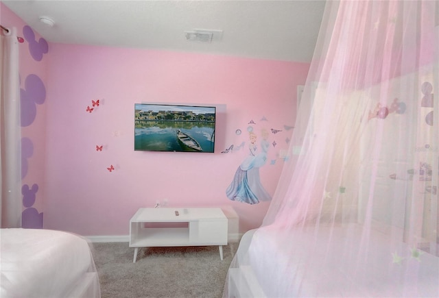 bedroom featuring visible vents, baseboards, and carpet