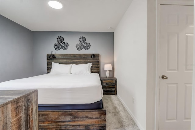 carpeted bedroom featuring baseboards