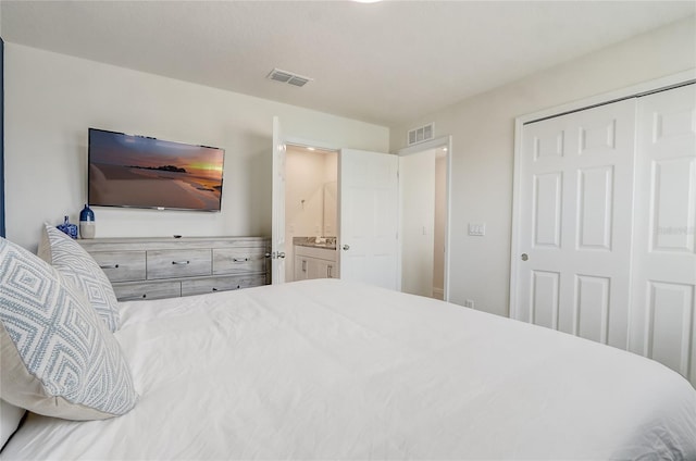 bedroom featuring ensuite bathroom and a closet