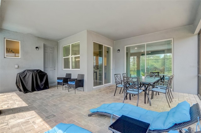 view of patio featuring outdoor dining space and grilling area